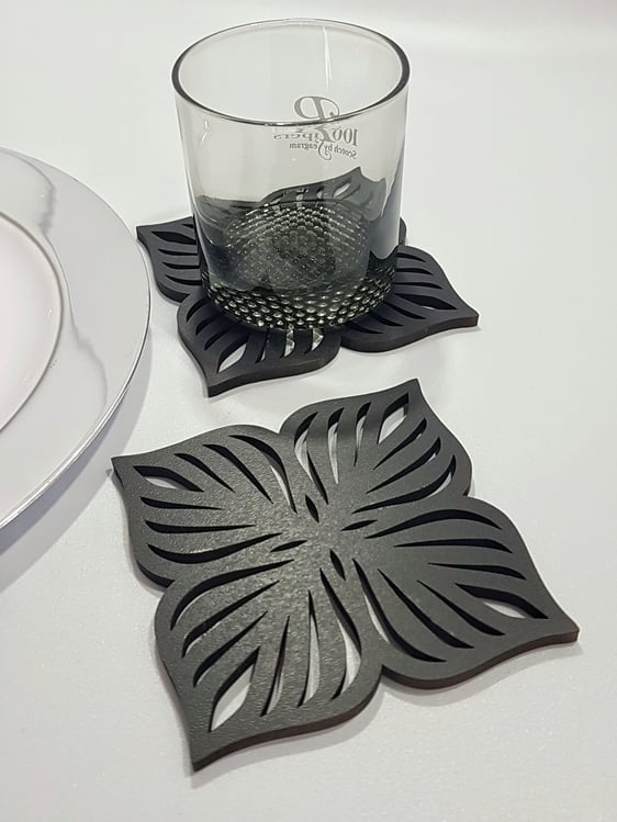 black coaster with detailed laser cut